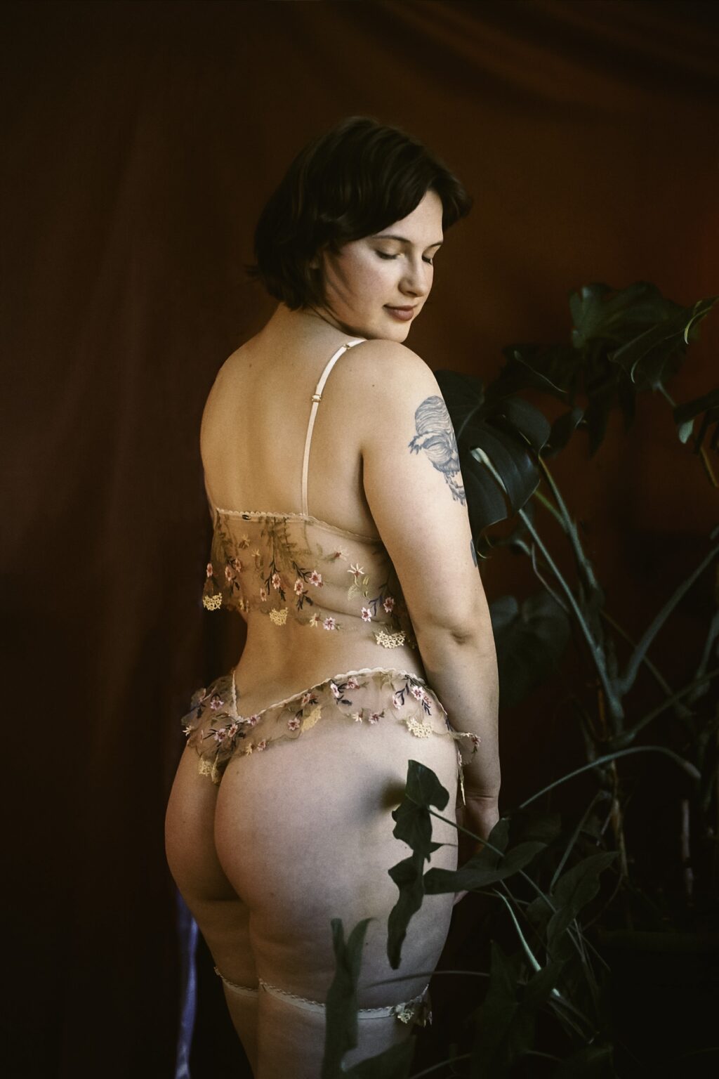 Ivy Maxwell wearing delicate lace lingerie, her curvy bottom visible